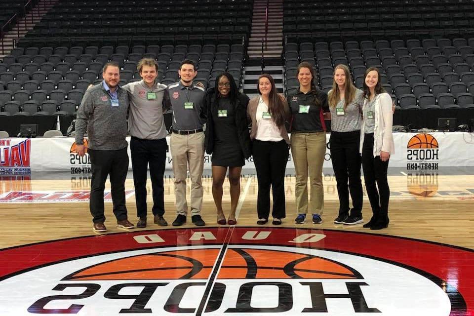 Maryville University Rawlings Sport Management degree students working a the MVC basketball championships